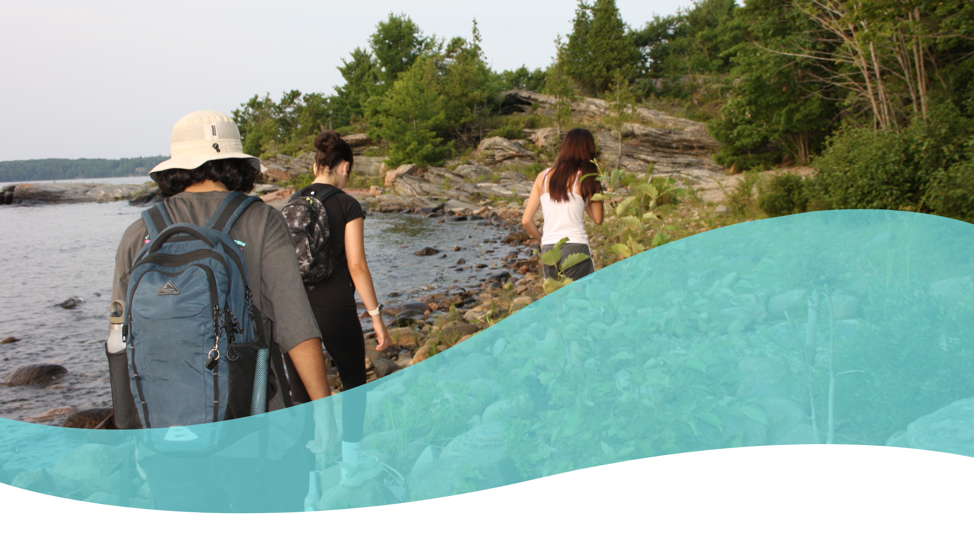 Multiple excited teenagers holding a banner that reads "Georgian Bay Youth Climate Collective"
